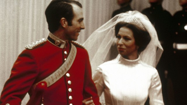 Captain Mark Phillips smiling at Princess Anne on their wedding day