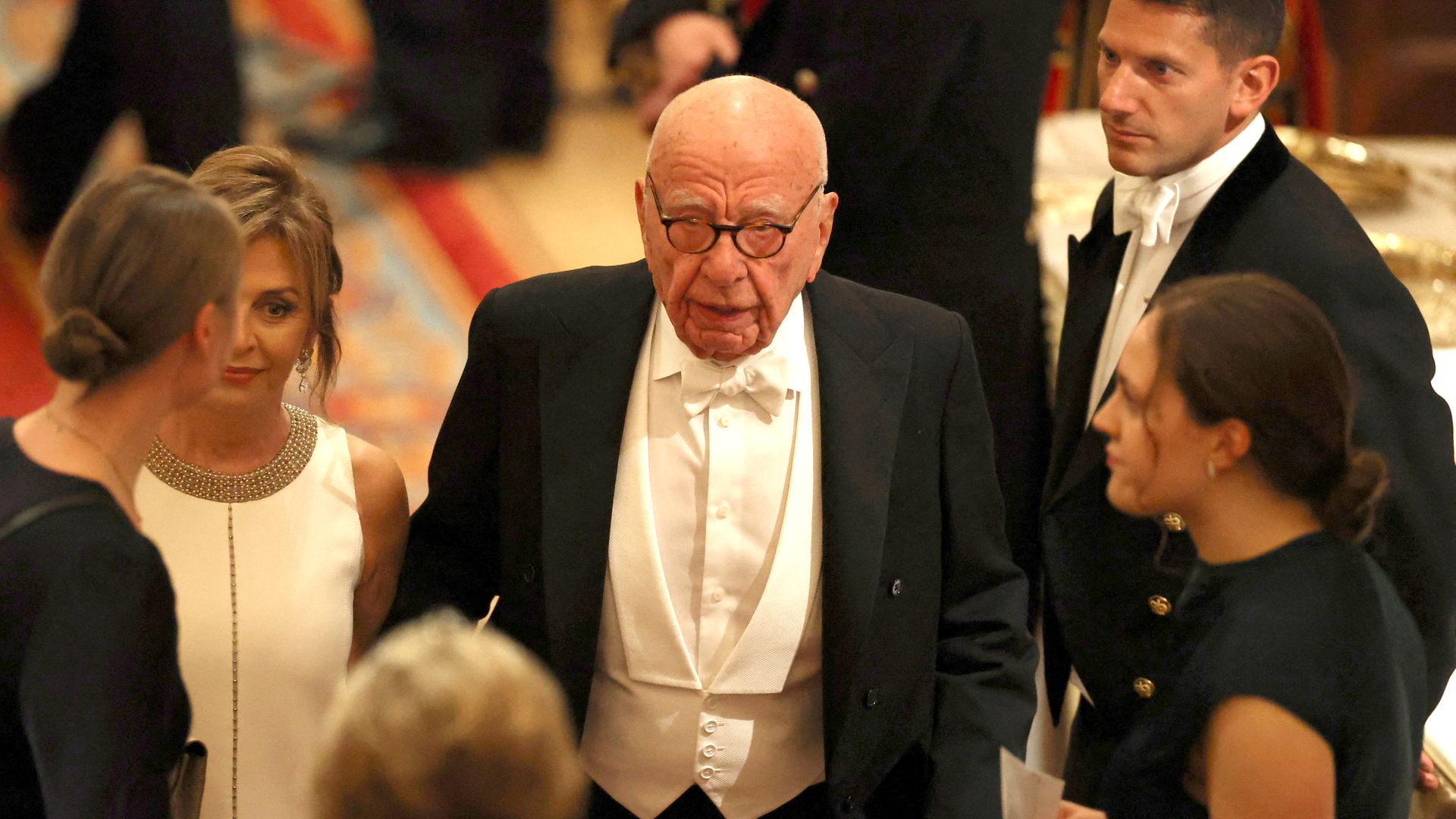 Rupert Murdoch in a black suit and white shirt at a State Banquet