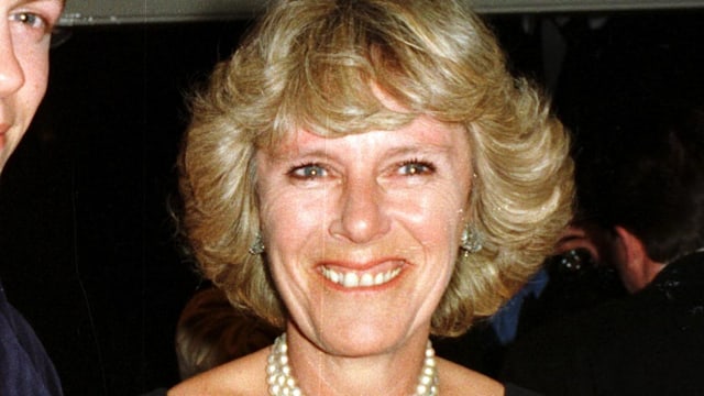 Camilla Parker-Bowles wearing a black dress and emerald choker