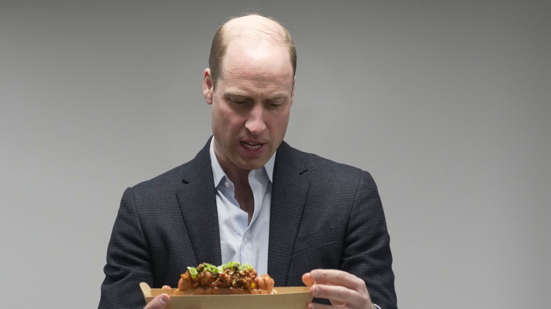 Prince William holding a seaweed-based good container