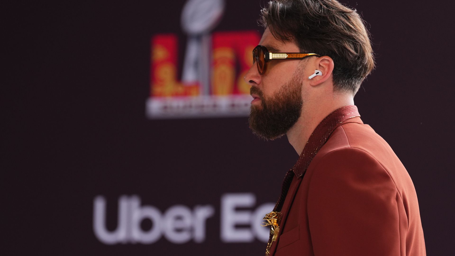 Travis Kelce turns heads in ‘Bee Gees’ style outfit as he makes show stopping entrance to the Super Bowl