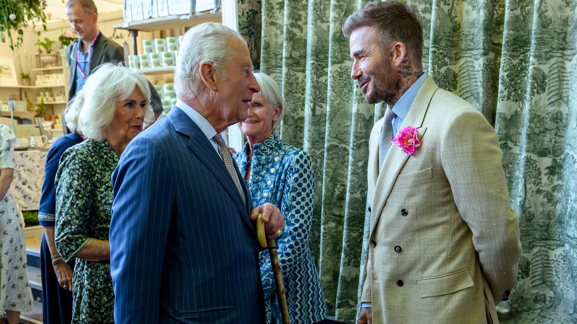 Queen Camilla and King Charles speaking to David Beckham