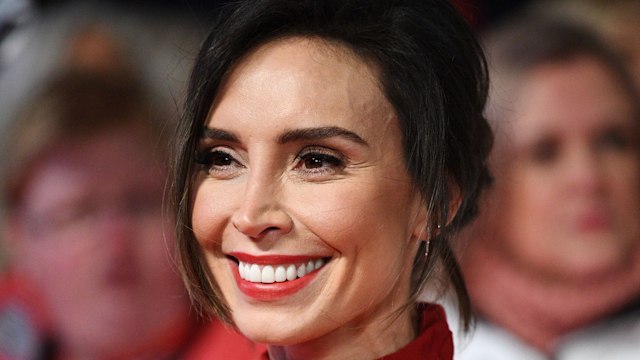 woman on red carpet in red dress