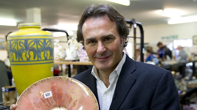 Man holding antique