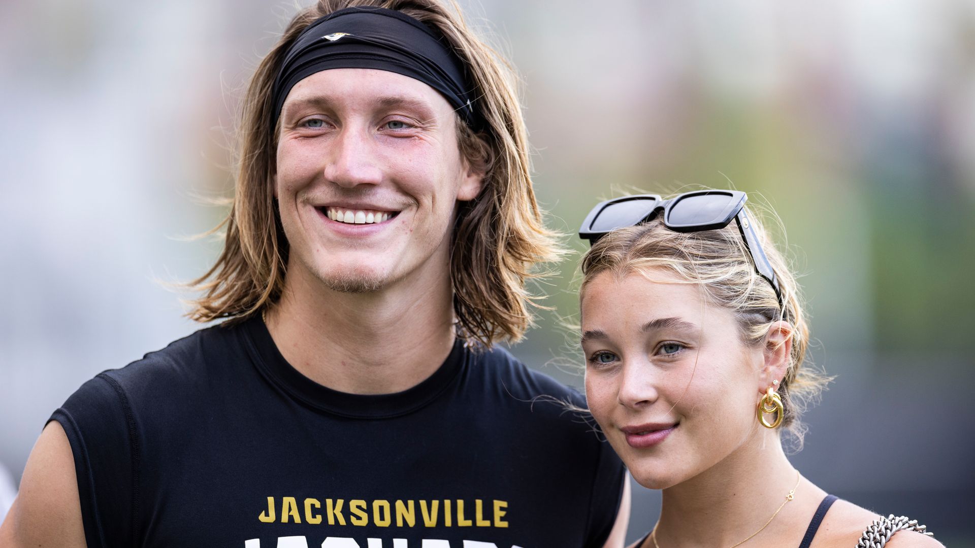 Trevor Lawrence #16 of the Jacksonville Jaguars poses for a photo with his wife Marissa during Training Camp at Miller Electric Center on August 02, 2023 in Jacksonville, Florida