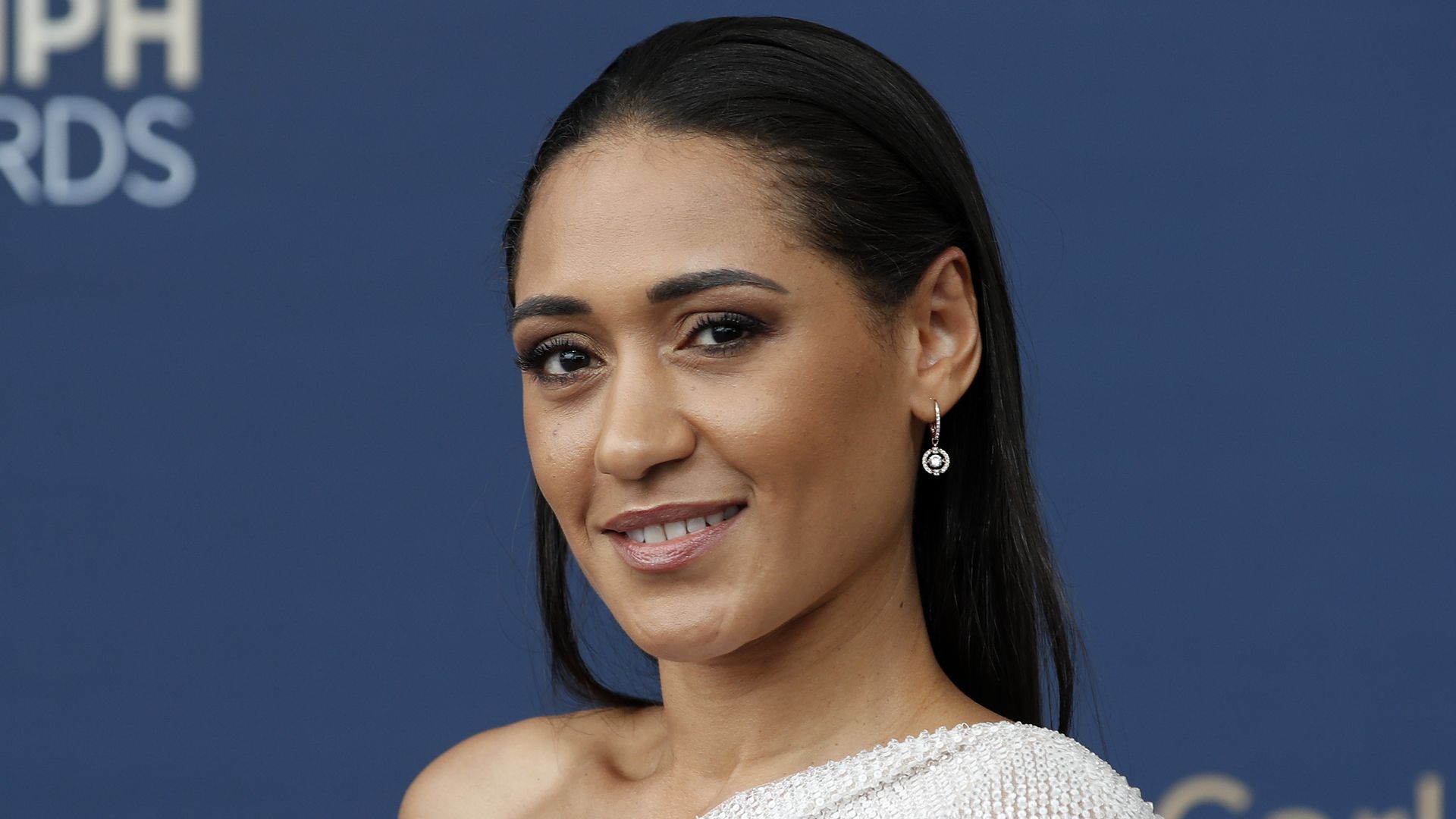 close-up brunette woman posing on red carpet