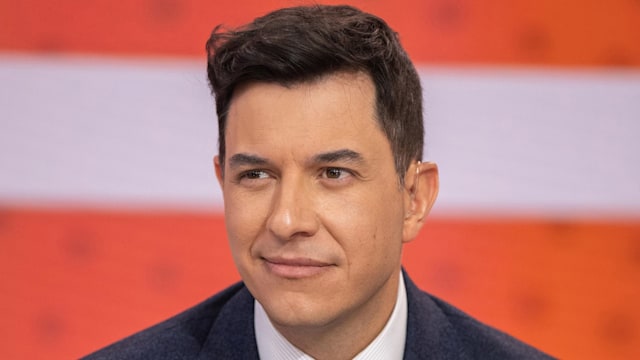 Tom Llamas smiles coyly