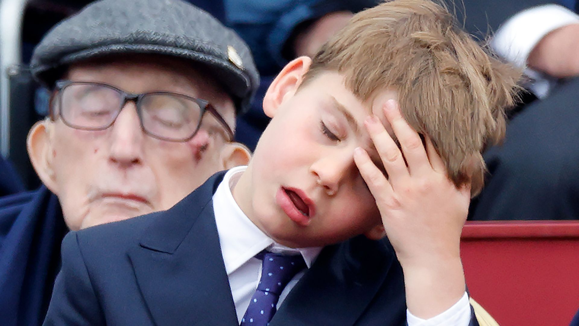 Prince Louis of Wales is exhausted during the military procession down The Mall on May 5, 2025, to mark the 80th anniversary of VE Day in London, England.