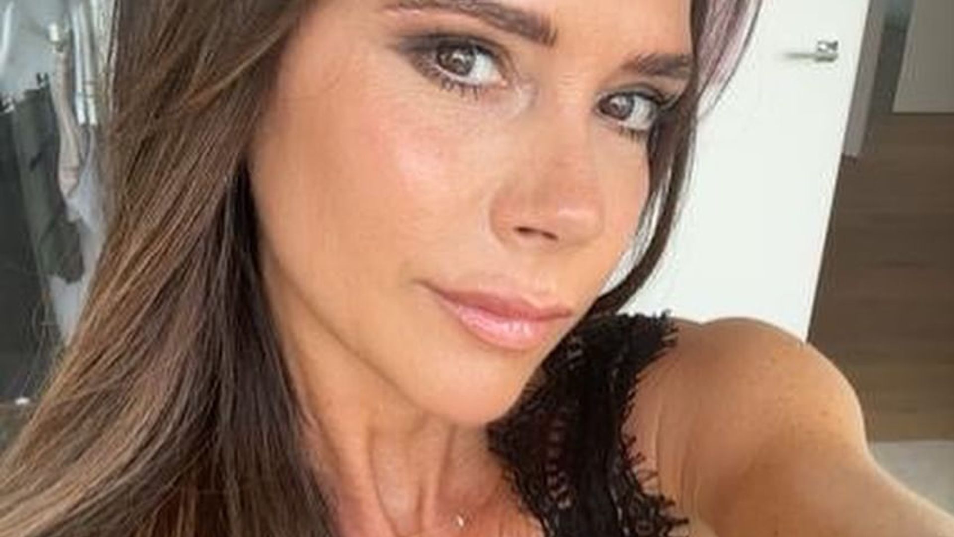 Victoria Beckham wearing plunging lace outfit in London home