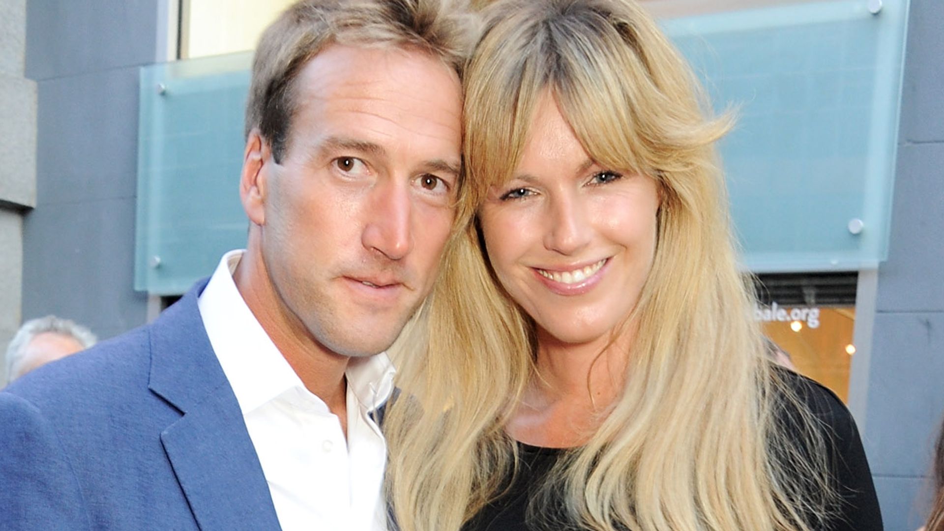 Ben Fogle in a blue suit with his wife Marina in a black dress