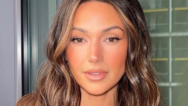 Michelle Keegan with wavy hair nude makeup and bronzed makeup 