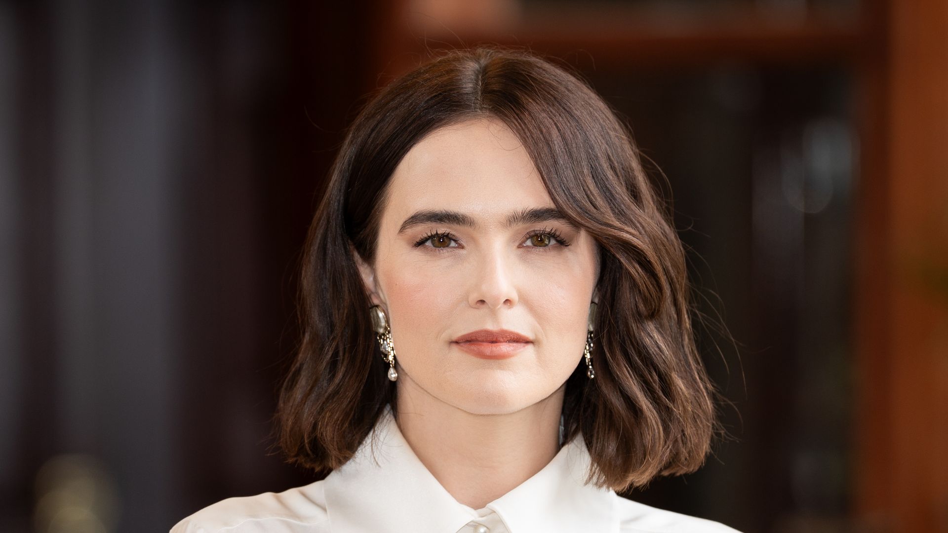 Zoey Deutch attends a photocall during the 51st Deauville American Film Festival on September 12, 2025 in Deauville, France