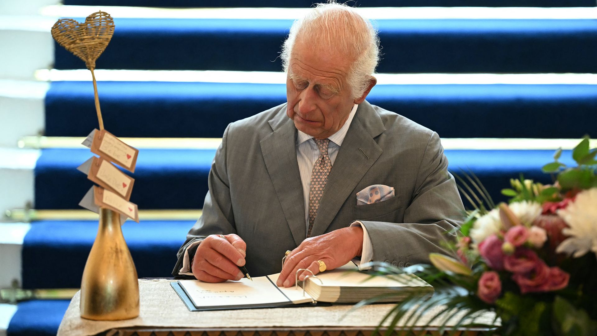 charles signing book of condolence 