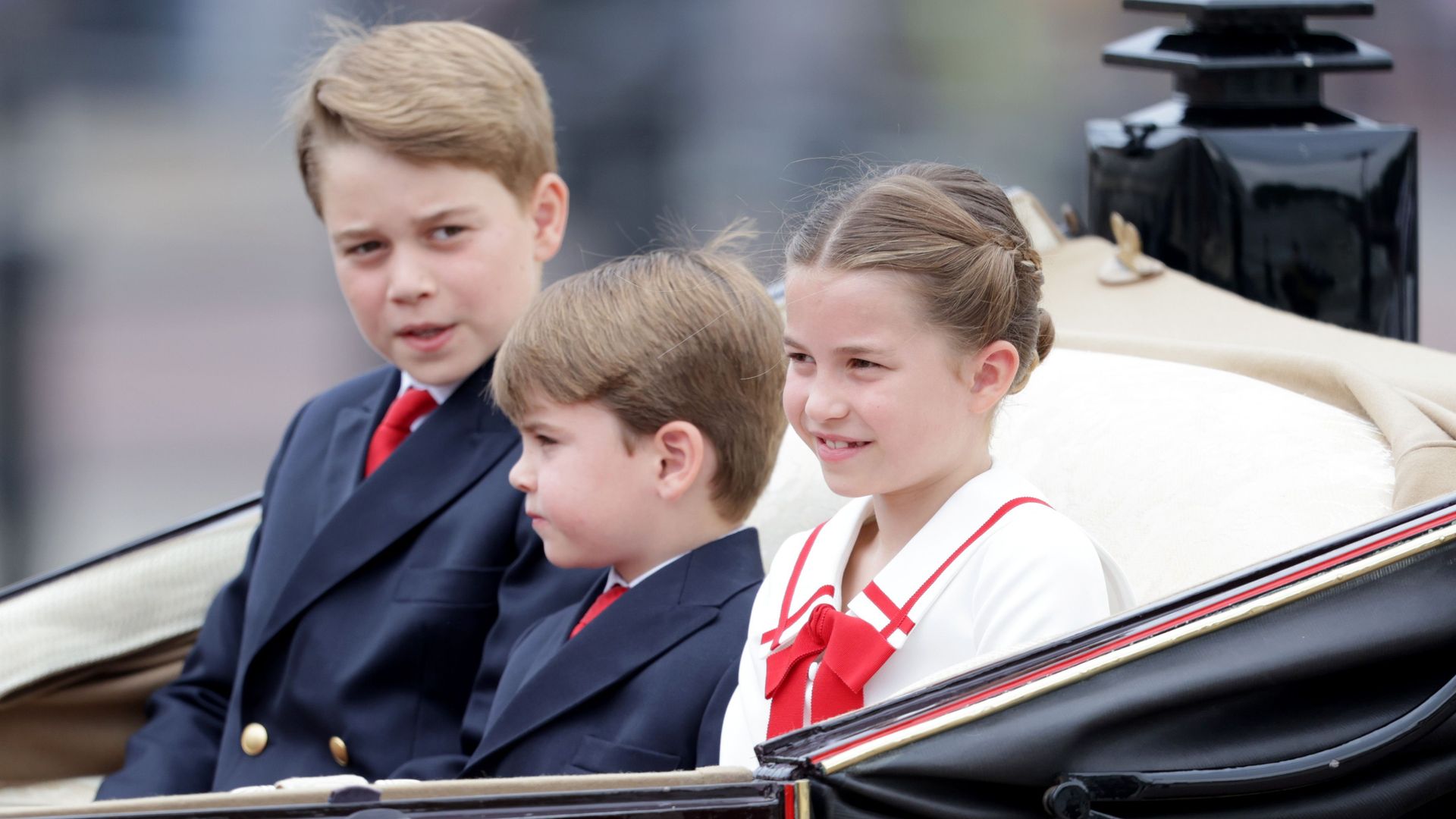 Princes George and Louis with Princess Charlotte at Trooping the Colour