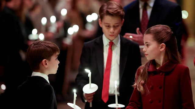 Prince Louis and Princess Charlotte during carol service with Prince George following closely behind