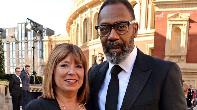 Lisa Makin in a black dress with Lenny Henry in a suit