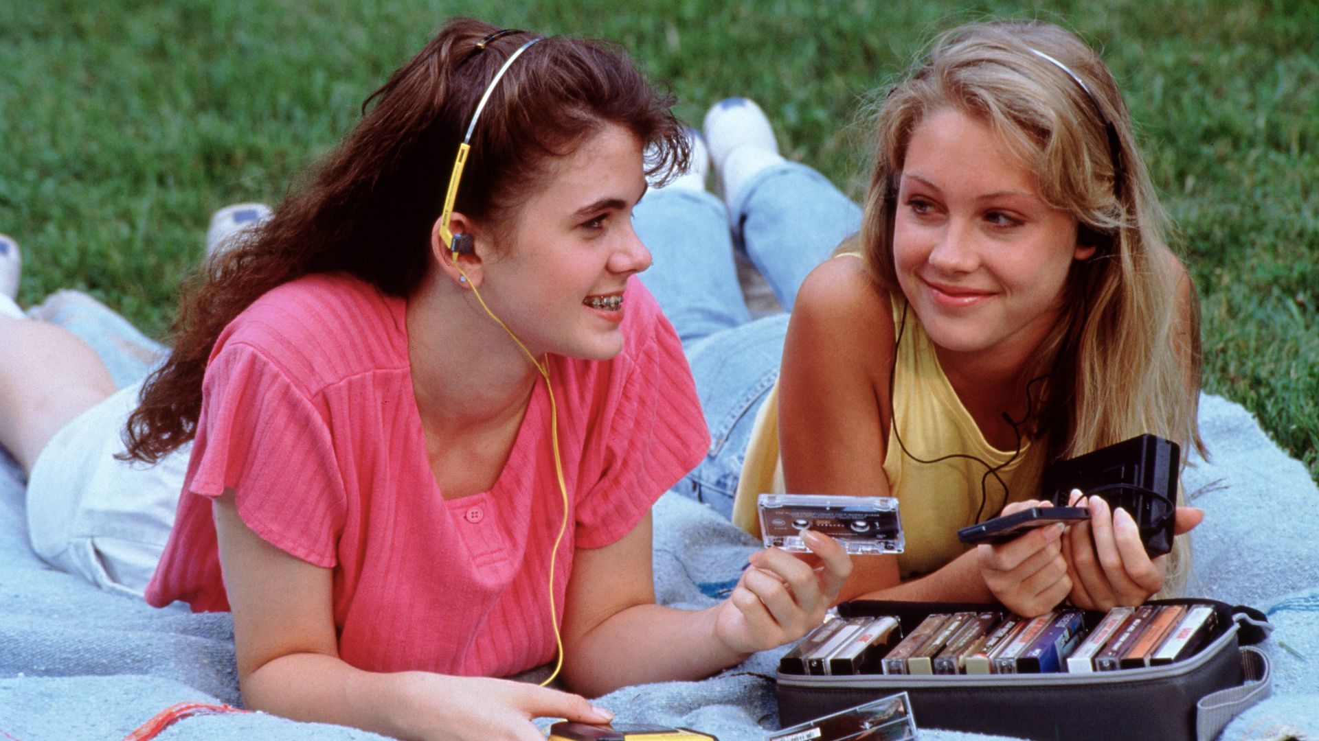 Two teenage girls listening to tapes