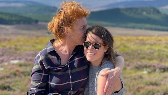 Sarah Ferguson with her arms around Princess Eugenie in the countryside