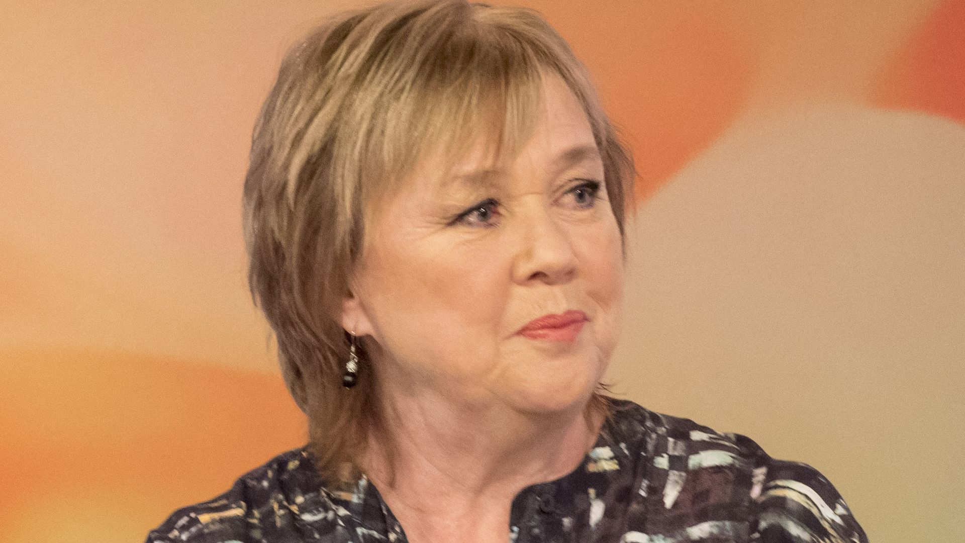 A photo of Pauline Quirke wearing a grey blouse