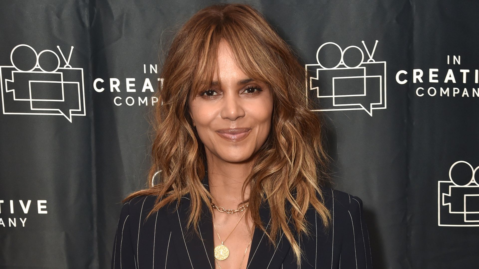 Halle Berry in pinstripe suit
