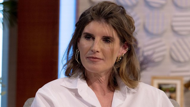 Amanda Owen in a white shirt looking at Lorraine while filming TV interview