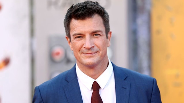 Nathan Fillion wearing a blue suit at The Suicide Squad premiere. 