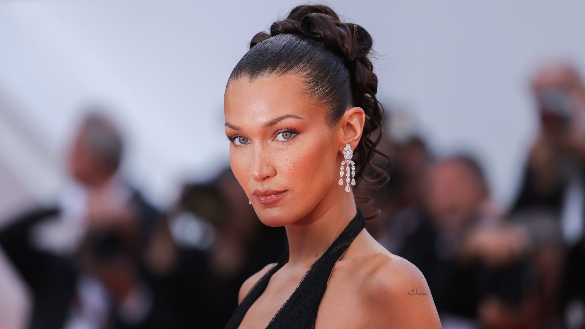 Bella Hadid debuts a daring new fringe whilst dripping in diamonds