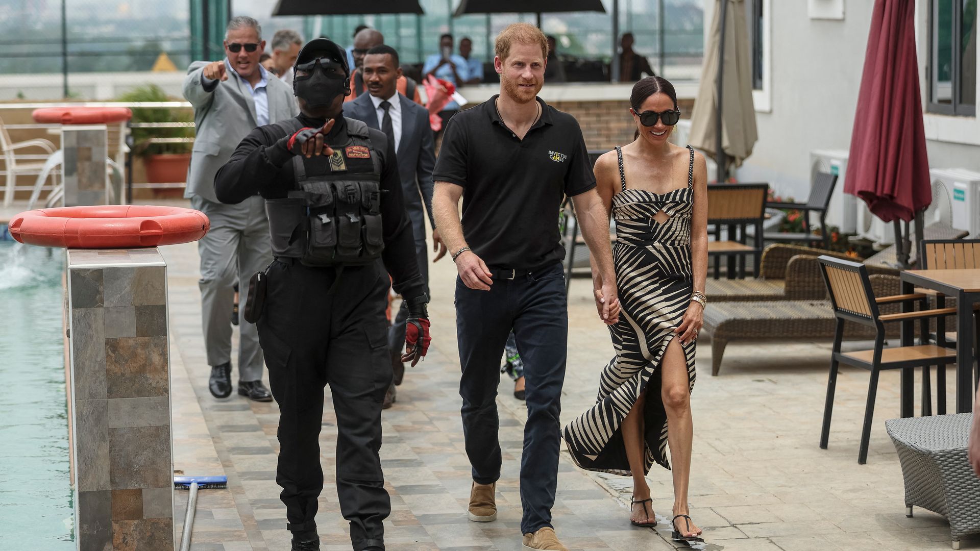 Prince Harry and Meghan arrive for a sitting volleyball match at Nigeria Unconquered, a local charity organisation that supports wounded, injured, or sick servicemembers, in Abuja