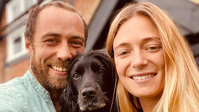 james middleton taking selfie in front of house with wife and dog 