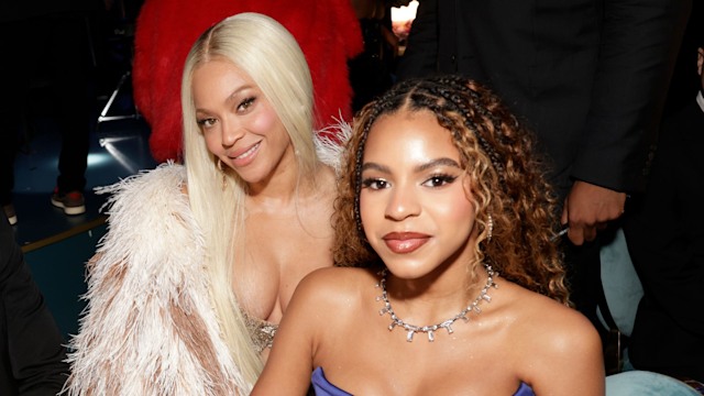 jay z beyonce blue ivy sitting down at table and smiling for camera
