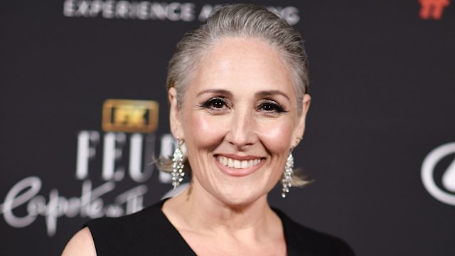 ricki lake smiling at camera on red carpet
