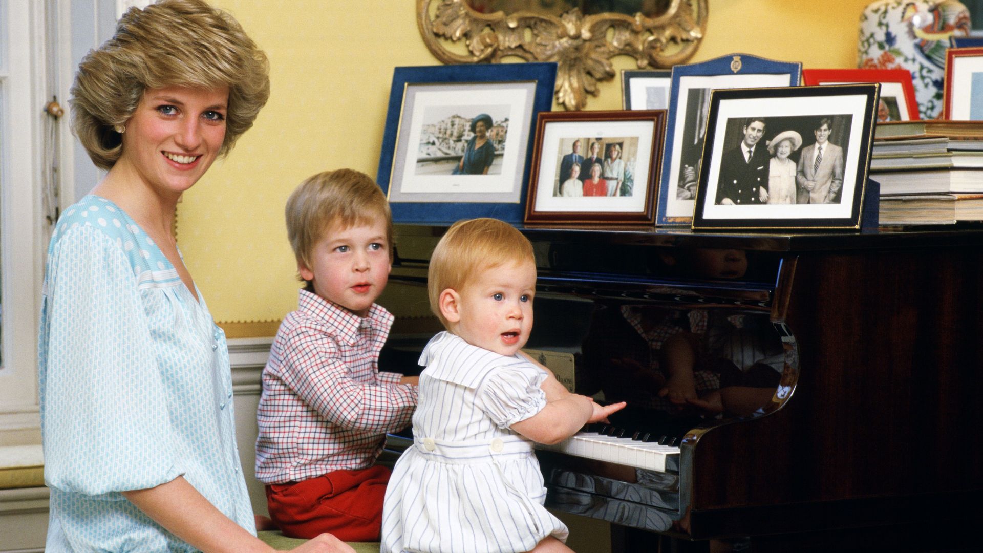 Princess Diana behind Prince William and Prince Harry at a piano