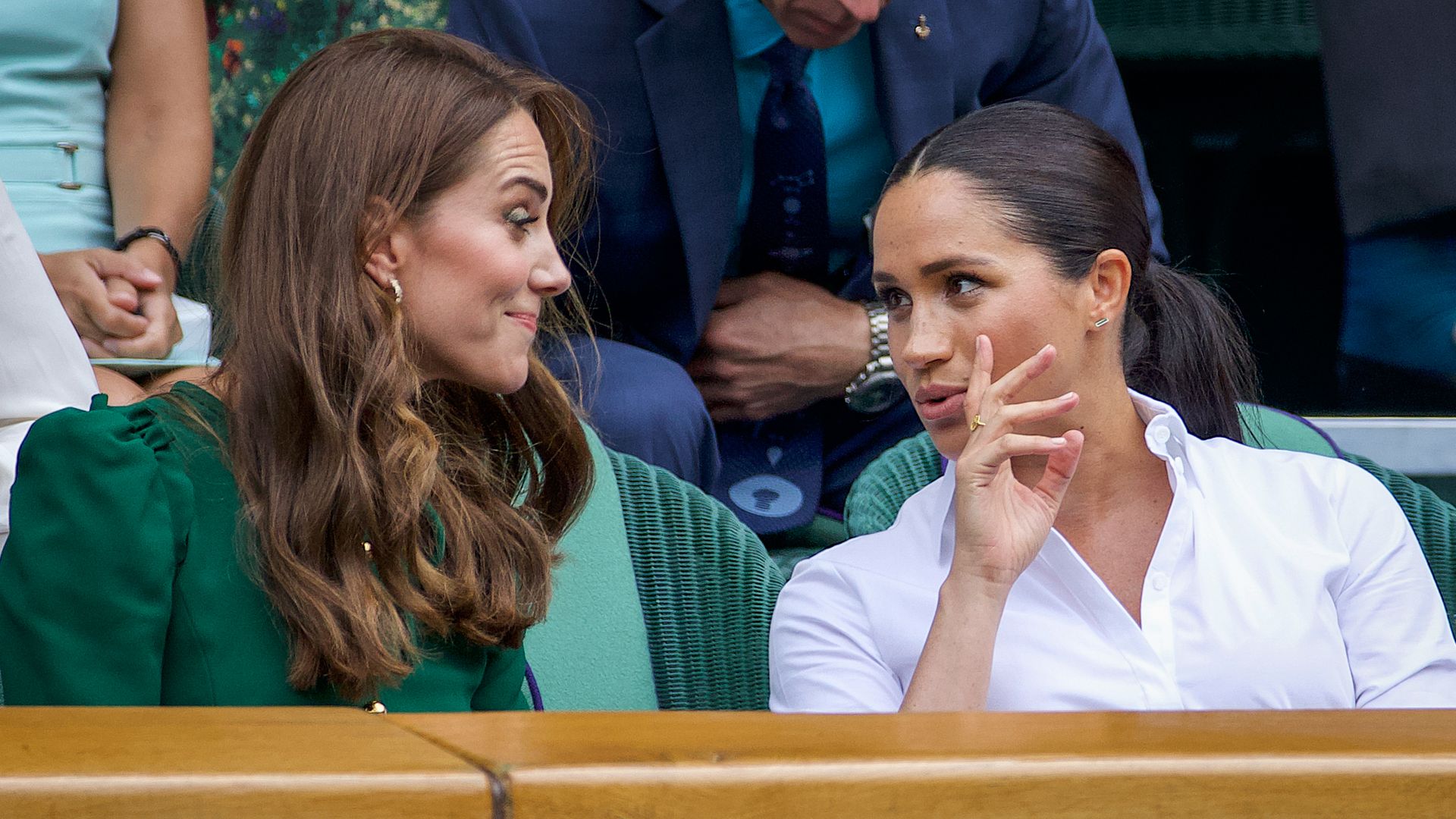 Kate Middleton and Meghan Markle chatting at Wimbledon