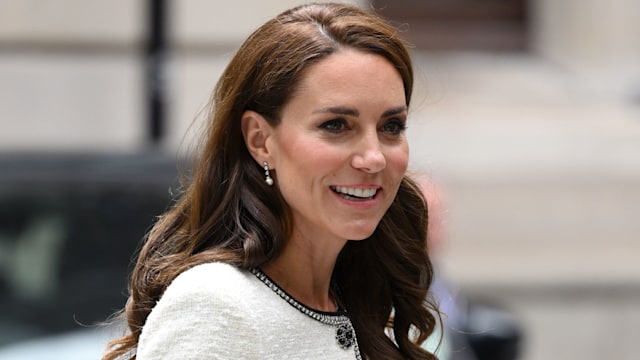 Princess of Wales wearing a white jacket with black trims 