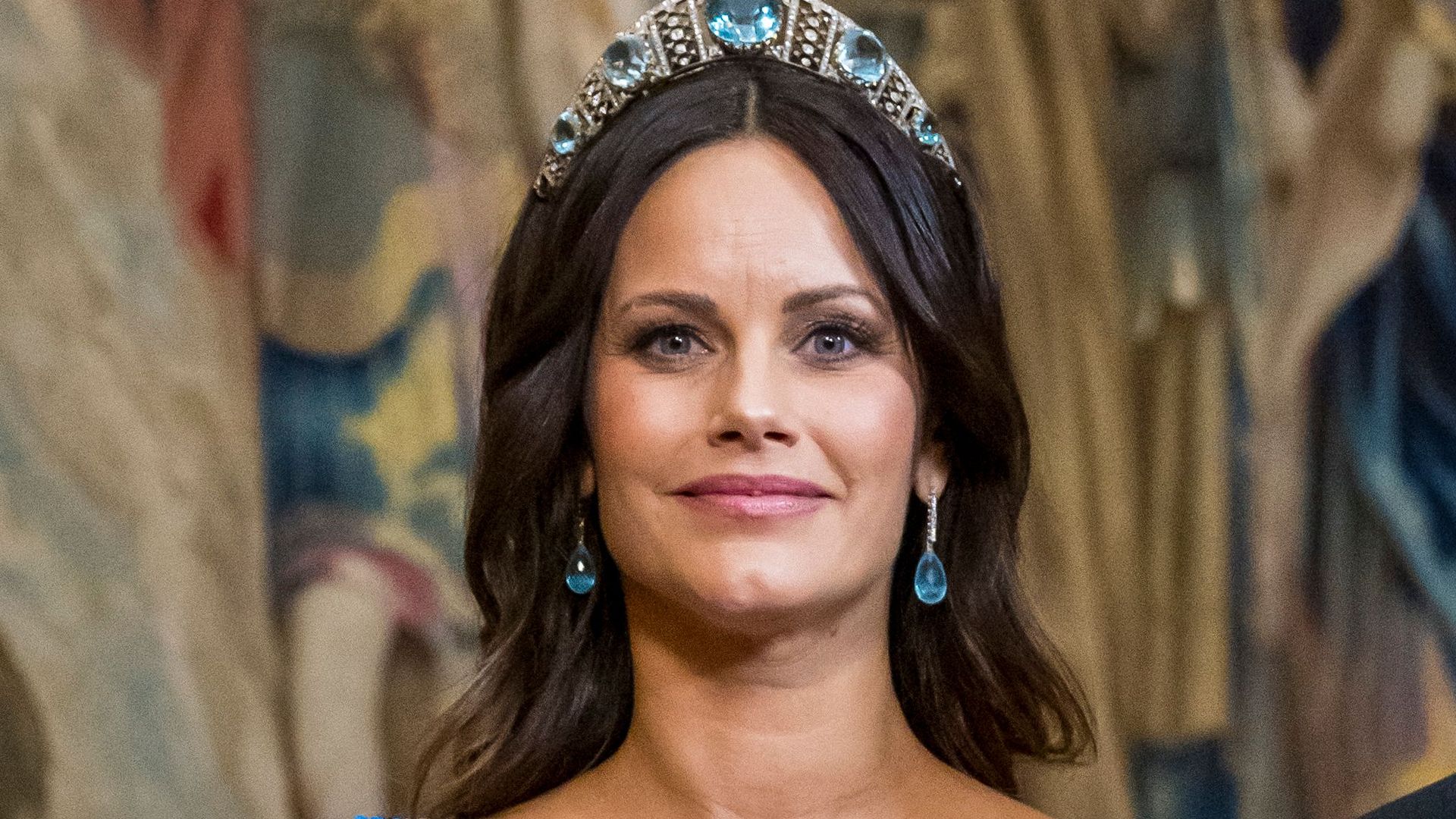 Princess Sofia glows in borrowed bump-skimming sequin gown and rarely-seen tiara