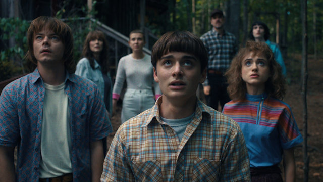 Charlie Heaton as Jonathan Byers, Winona Ryder as Joyce Byers, Millie Bobby Brown as Eleven, Noah Schnapp as Will Byers, David Harbour as Jim Hopper, Natalia Dyer as Nancy Wheeler, and Finn Wolfhard as Mike Wheeler in STRANGER THINGS. Cr. Courtesy of Netflix 