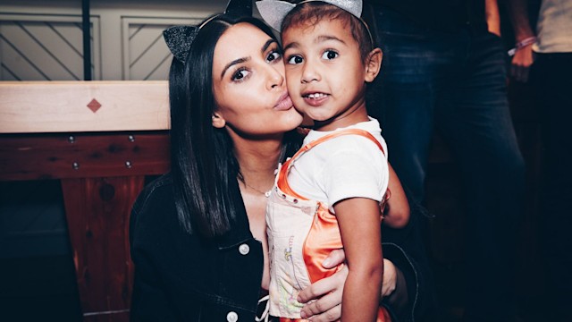 Kim kissing her daughter North 