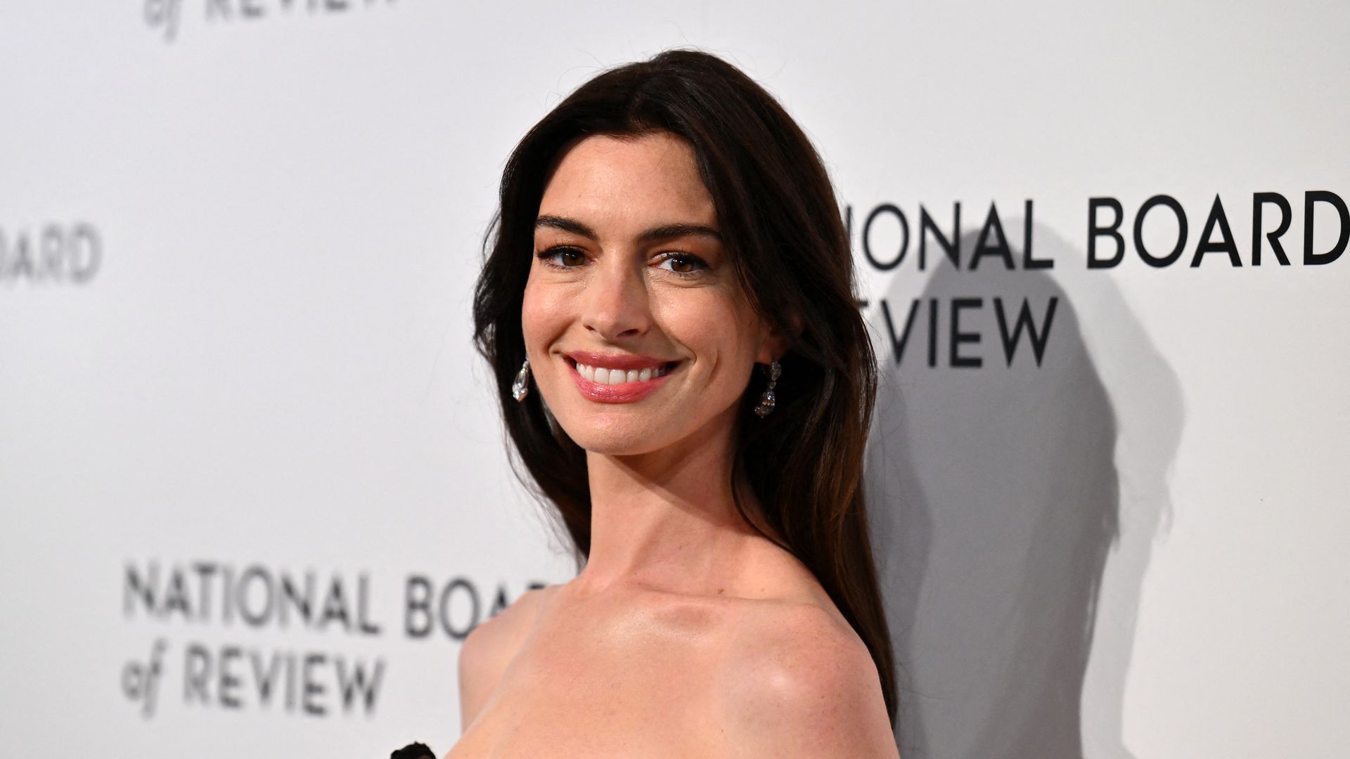 Anne Hathaway attends the National Board of Review annual awards gala in a black plunging neckline gown