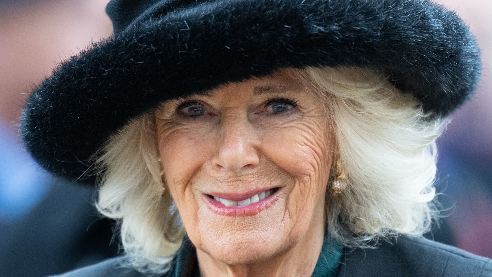 Queen Camilla in black hat