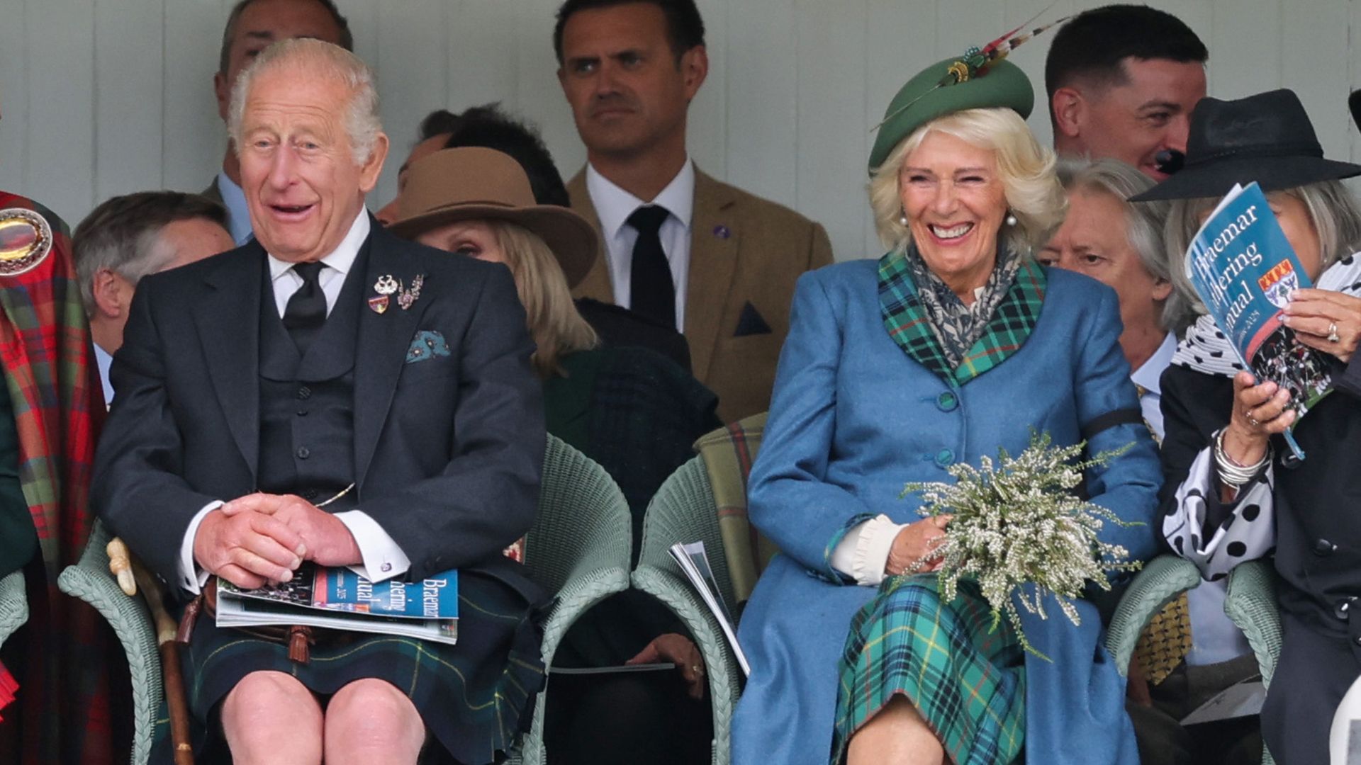 King Charles and Queen Camilla laughing