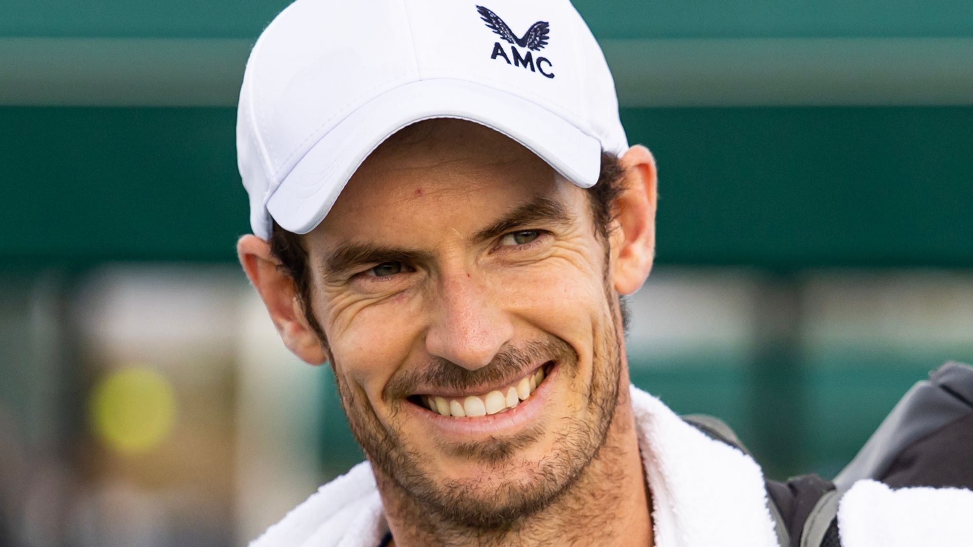 Andy Murray wearing a white baseball cap 