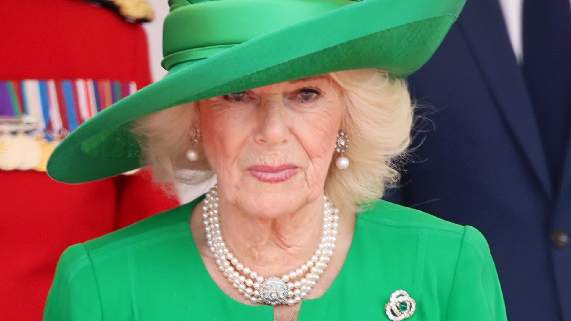 Queen Camilla in green hat and dress 