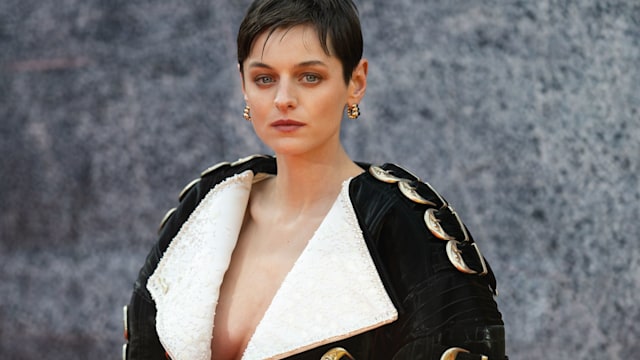 emma corrin with buckle-clad schiaparelli jacket