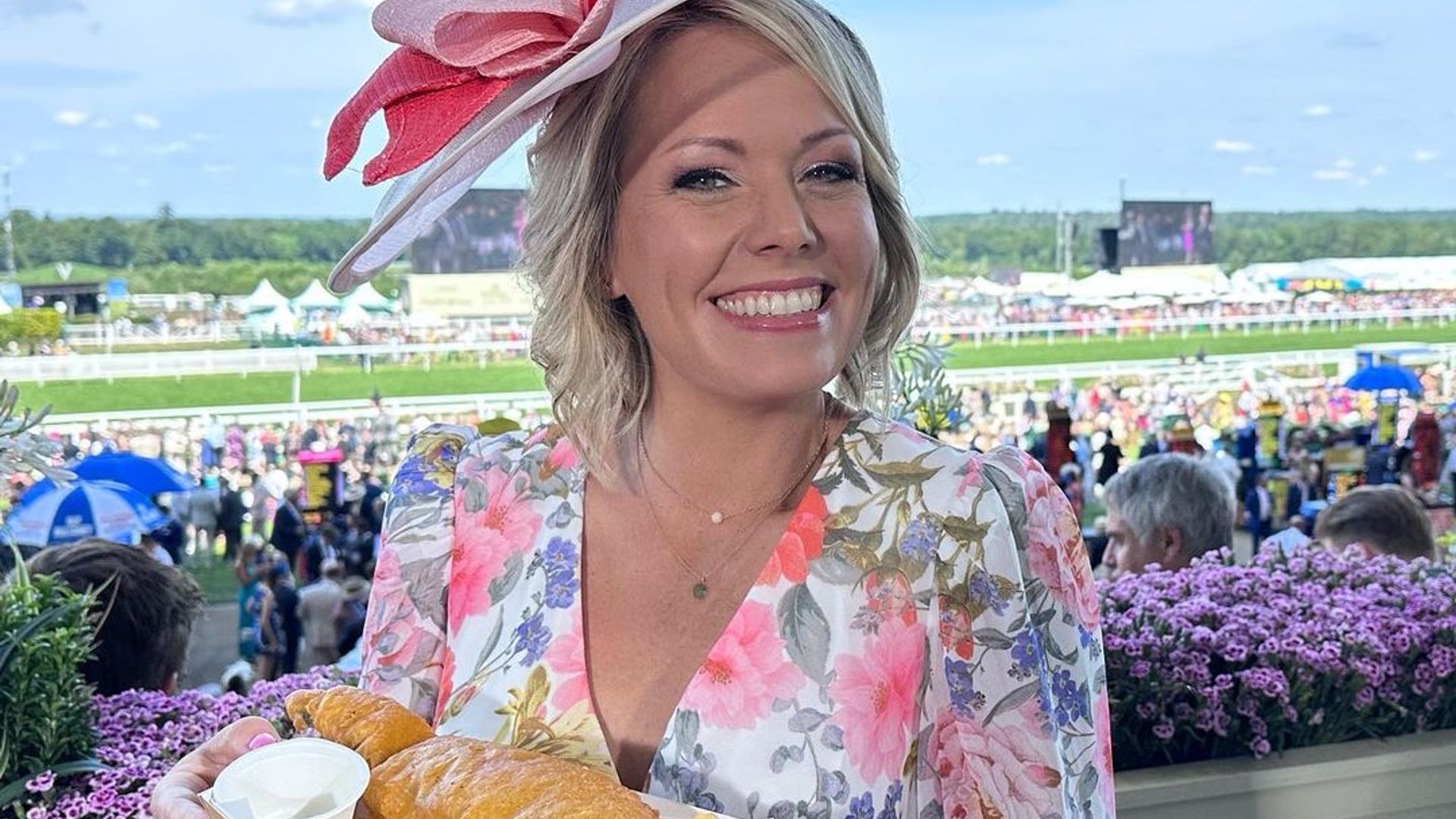 Dylan Dreyer holds plate of fish and chips at Ascot