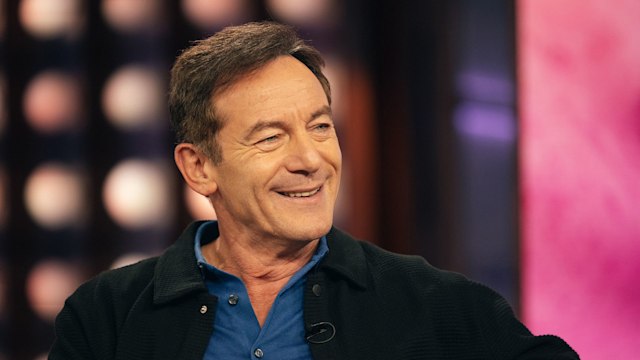 Jason Isaacs smiling while filming chat show appearance