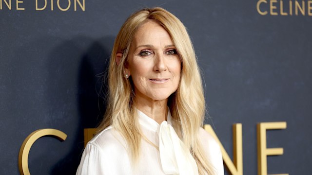 celine dion wearing white and smiling a documentary premiere