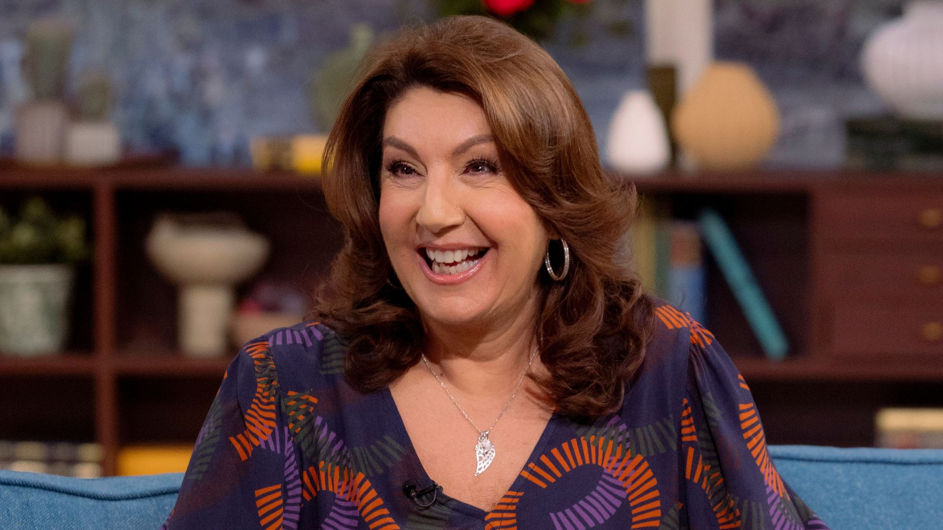 Jane McDonald in a purple outfit