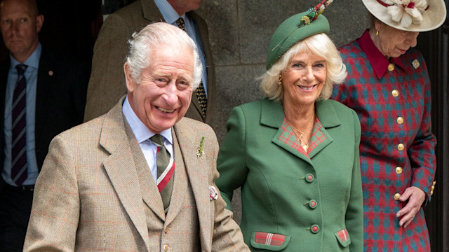 The King and Queen smiling as they leave church in Balmoral