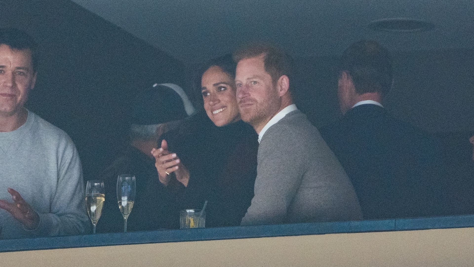 couple watching sport in arena 