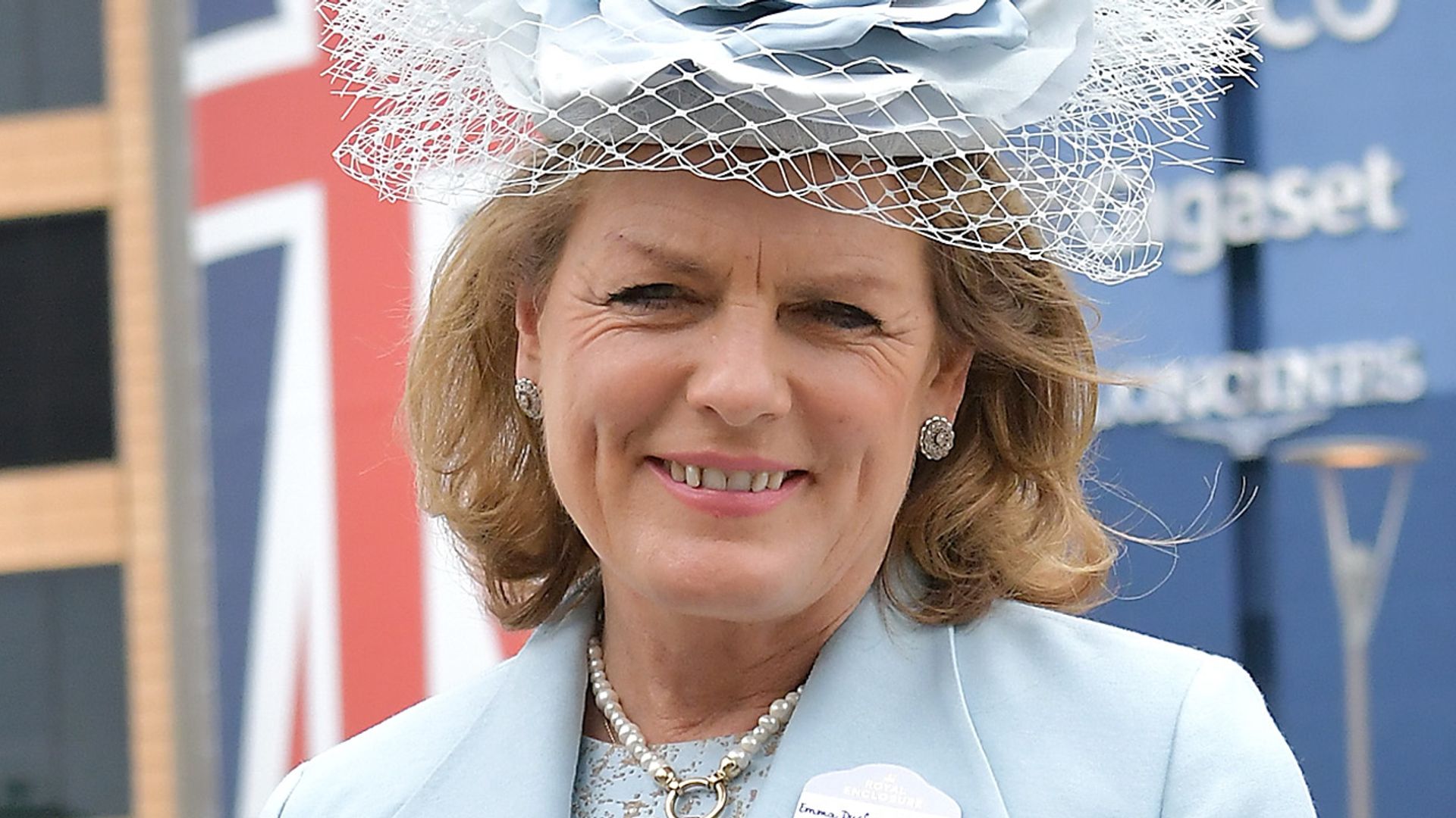 Duchess of Rutland in a blue floral fascinator and matching dress